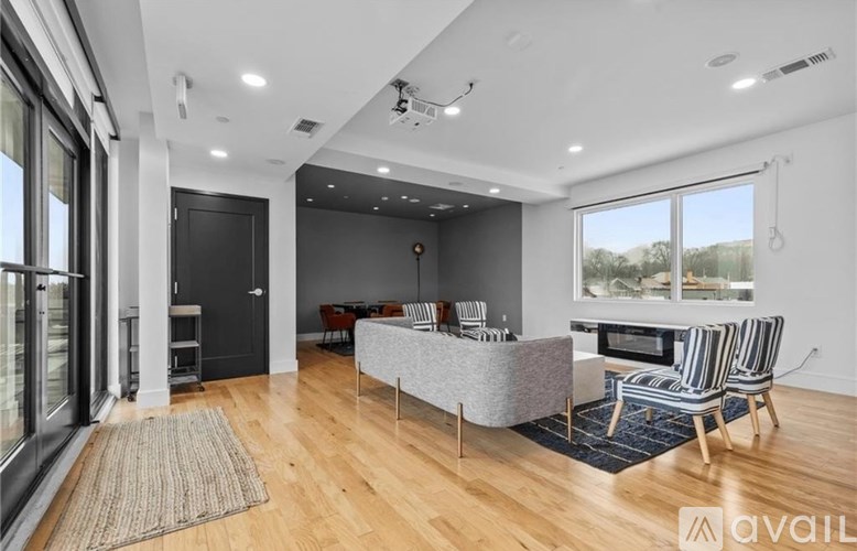 A gym with a variety of equipment including treadmills, weights, and exercise bikes.