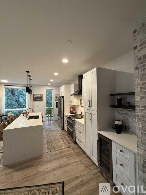 A white door is open to a hallway.