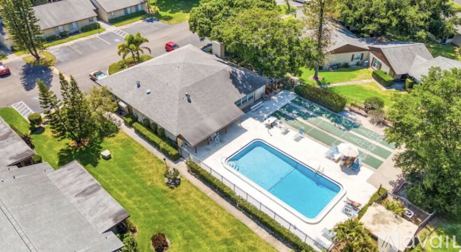 A large house with a pool in the backyard.