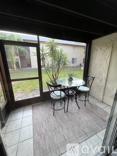 A patio with a table and chairs is shown.