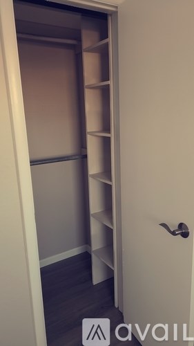 A white door with a handle and a sign that says "available" on the floor.