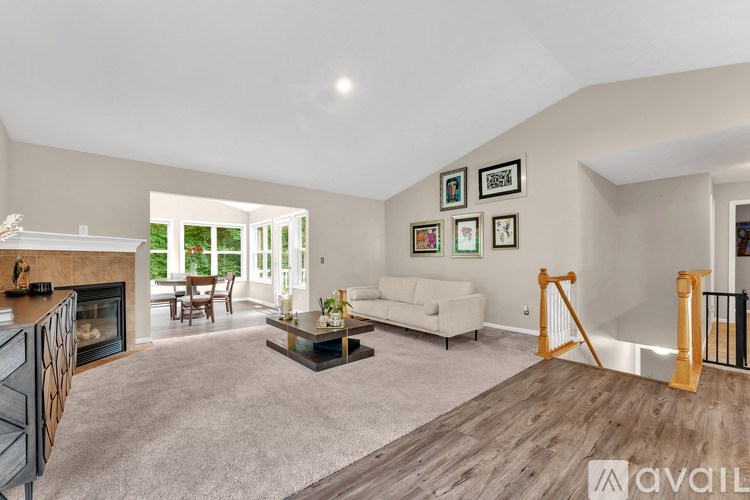 A living room with a fireplace and a couch.