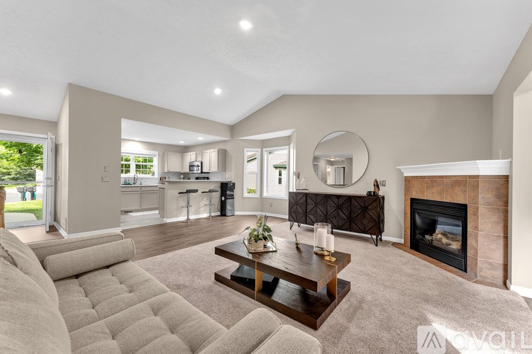 A living room with a fireplace and a couch.