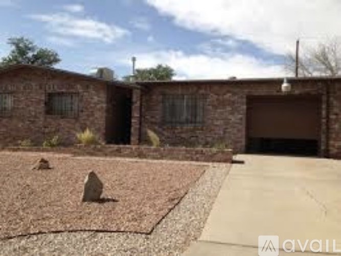 A house with a brown garage door and a brown roof.