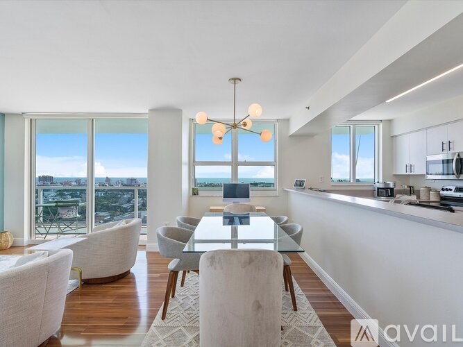 A modern dining room with a view of the ocean.