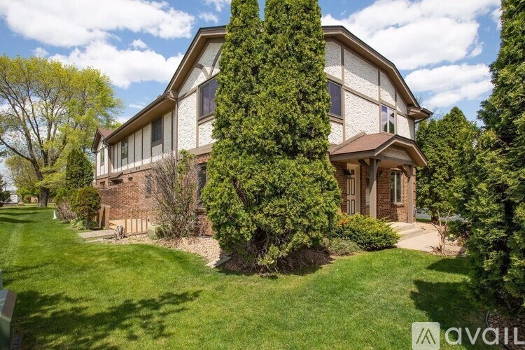 A house with a lawn in front of it.