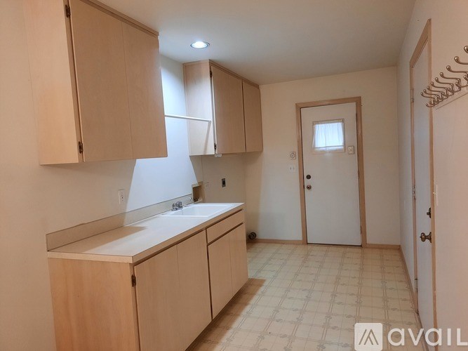 A bathroom with a sink, mirror, and toilet.