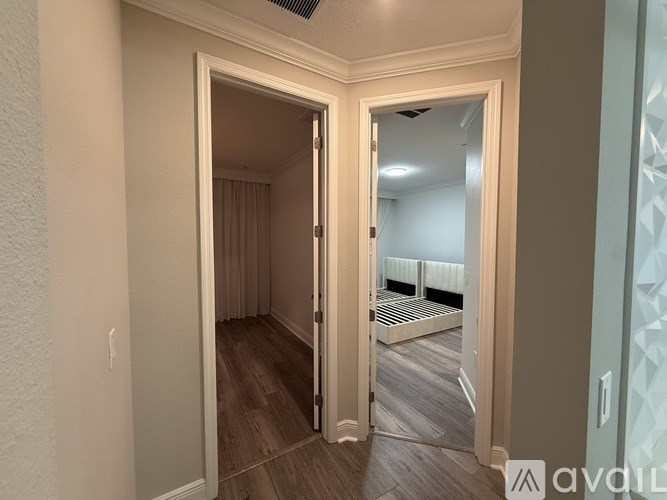 A room with a doorway leading to another room.