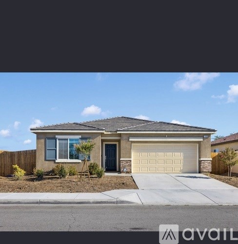 A house with a garage and a driveway is for sale.