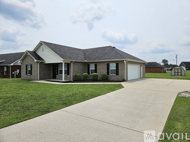 A house with a grey roof and a white garage door.