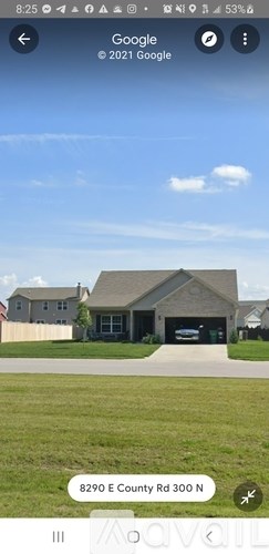 A house with a garage is located at 8290 E County Rd 300 N.