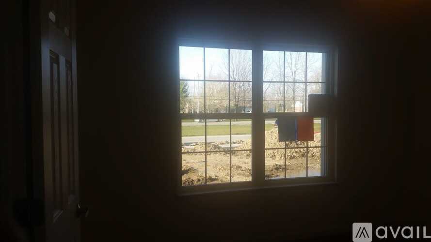 A window with a view of a construction site outside.