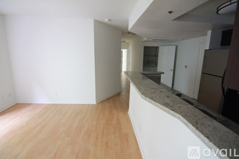 A kitchen area with a counter and cabinets.