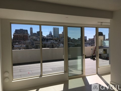 A balcony with a view of a city skyline.