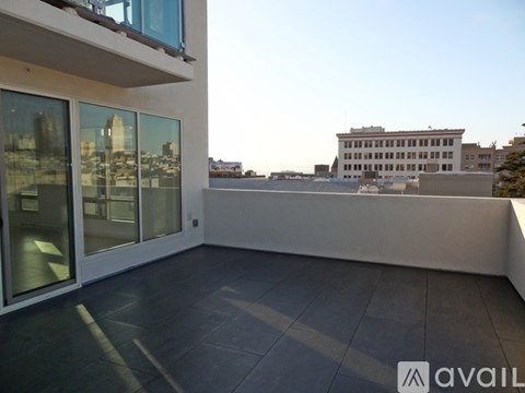 A balcony with a view of the cityscape.