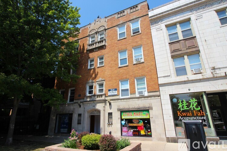 A building with a storefront that has a sign that says "Kwai Fah Acupuncture".