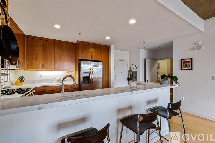 A kitchen with wooden cabinets and a white countertop.