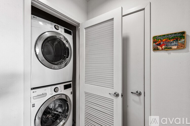 A stack of washing machines in a laundry room.