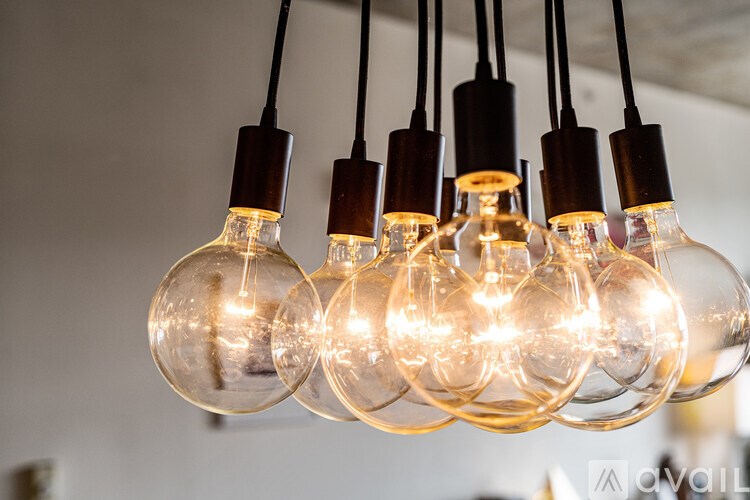 A chandelier with six globe-shaped lights hanging from the ceiling.