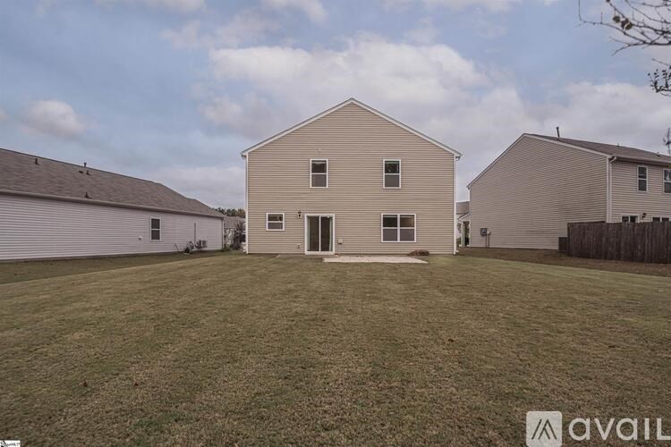 A house with a lawn in front of it is for sale.