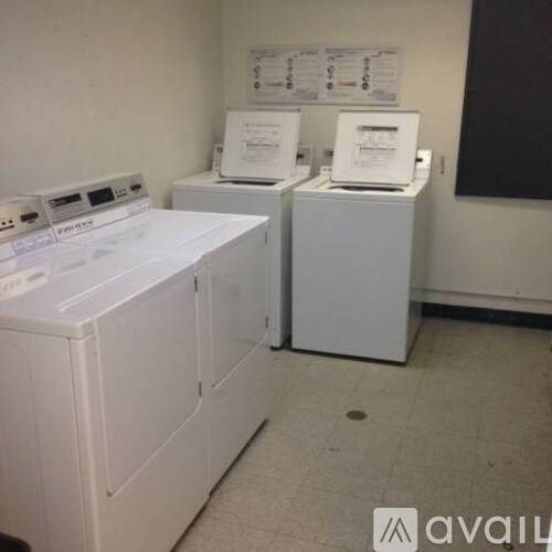 A white washing machine and dryer are available for use.