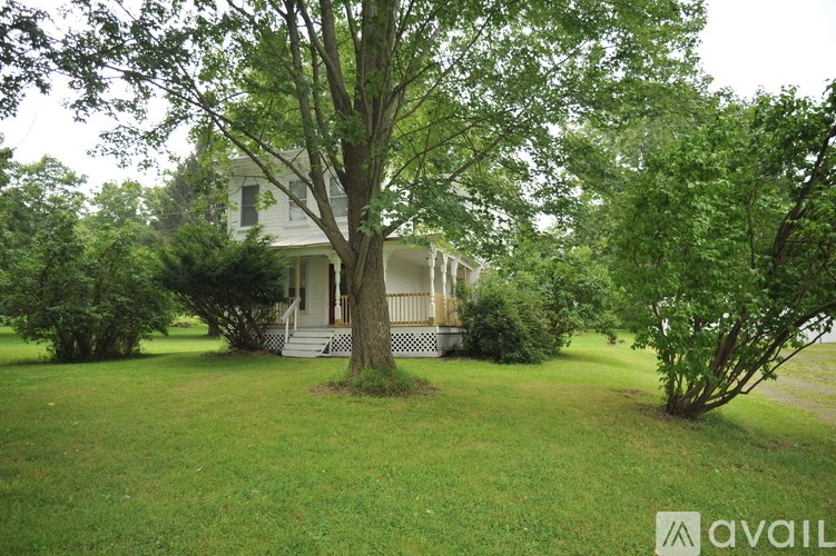 A house with a tree in front of it.