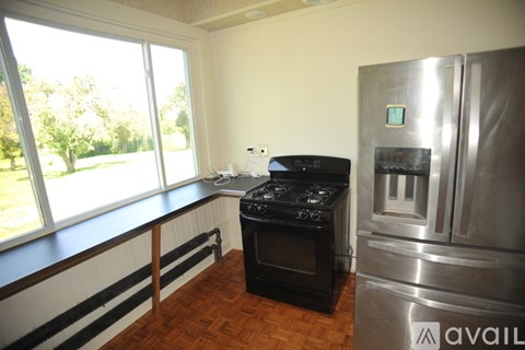 A kitchen with a stove, oven, and refrigerator.