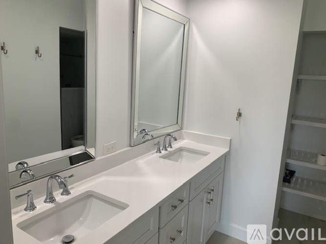 A bathroom with a sink and mirror.