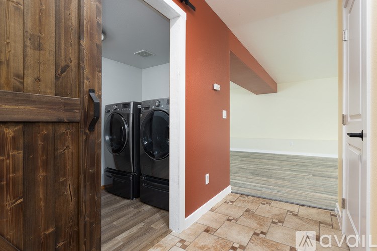 A laundry room with a washer and dryer.