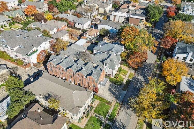 A bird's eye view of a residential area with houses and trees.