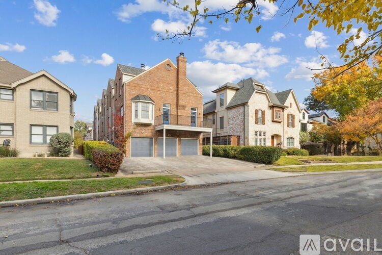 A row of houses with a clear blue sky above them.