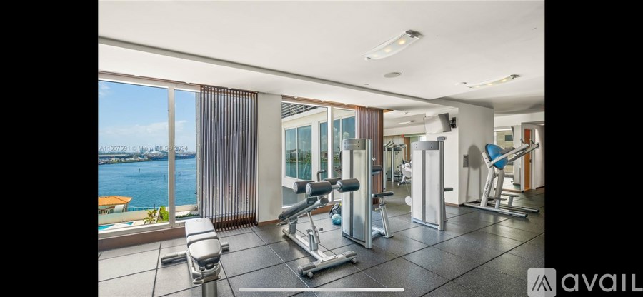 A gym with a view of the water.