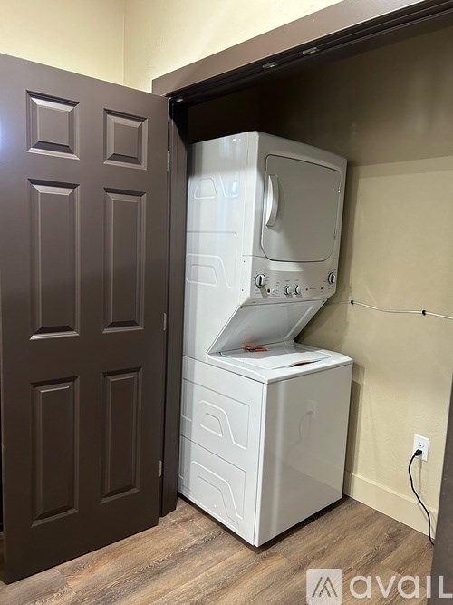 A white fridge and freezer in a room.