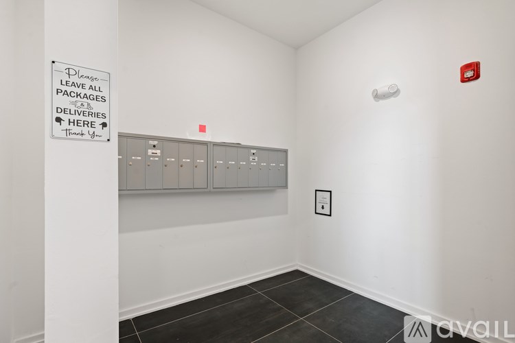 A sign in a room instructs to leave all packages at a designated spot.