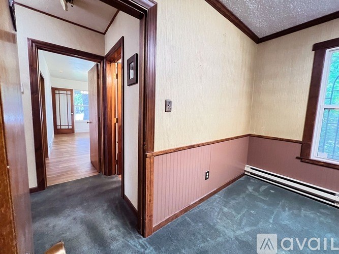 A room with a doorway leading to another room.