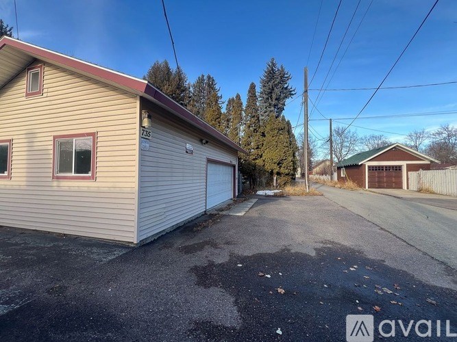 A two-story house with a garage is available for rent.