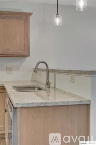 A kitchen with a sink and a countertop.