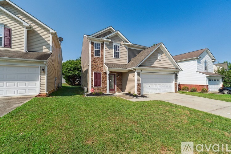 A house with a brown brick chimney is for sale.