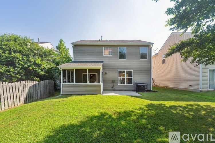 A house with a large front yard is for sale.