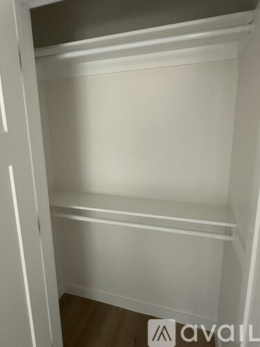 A white closet with shelves and a logo that reads "avail".