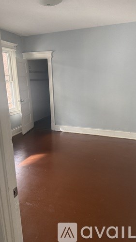 A room with a door and a wall.