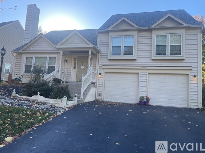 A house with a driveway in front of it.