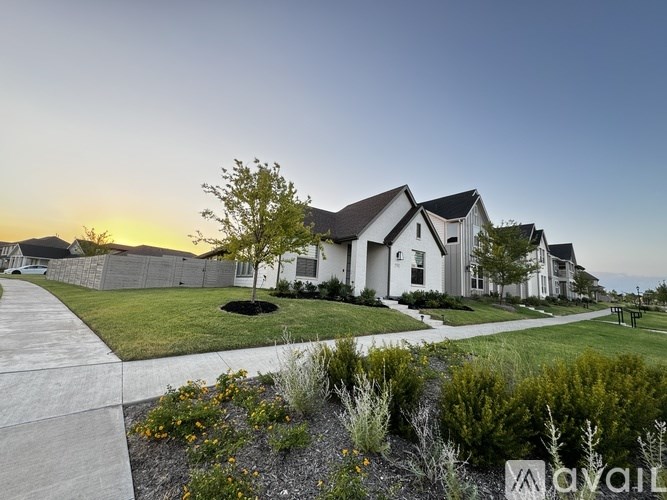 A row of houses with a sign that says "AVAIL" in front of them.