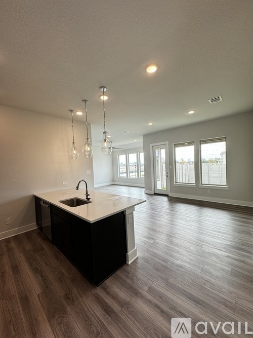 A kitchen with a sink and a countertop.