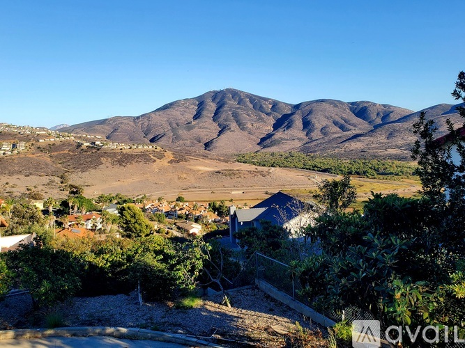 A mountain range with a town in the foreground.
