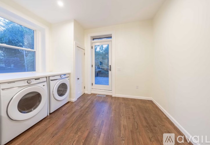 A laundry room with a washer and dryer.