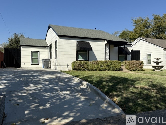 A house with a driveway in front of it.