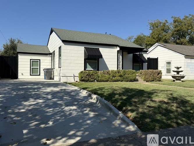 A house with a driveway in front of it.