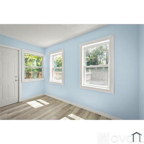 A room with blue walls and a white door.