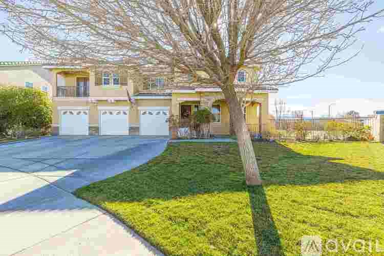 A house with a tree in front of it.
